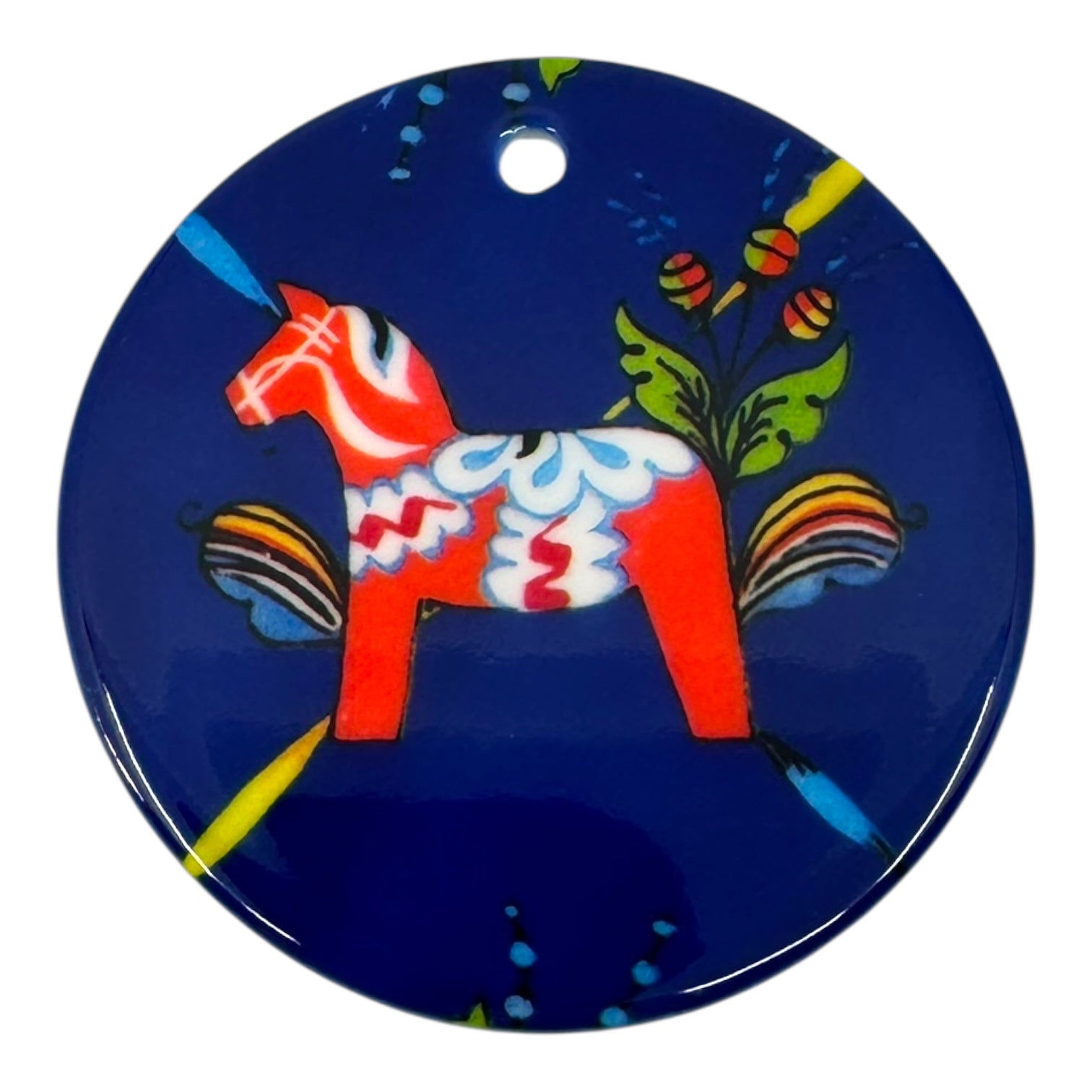 The Ornament: Dala Horse Ceramic 3 features Scandinavian charm—a round blue ceramic piece with a red, floral-patterned Dala horse and a top hole for hanging.