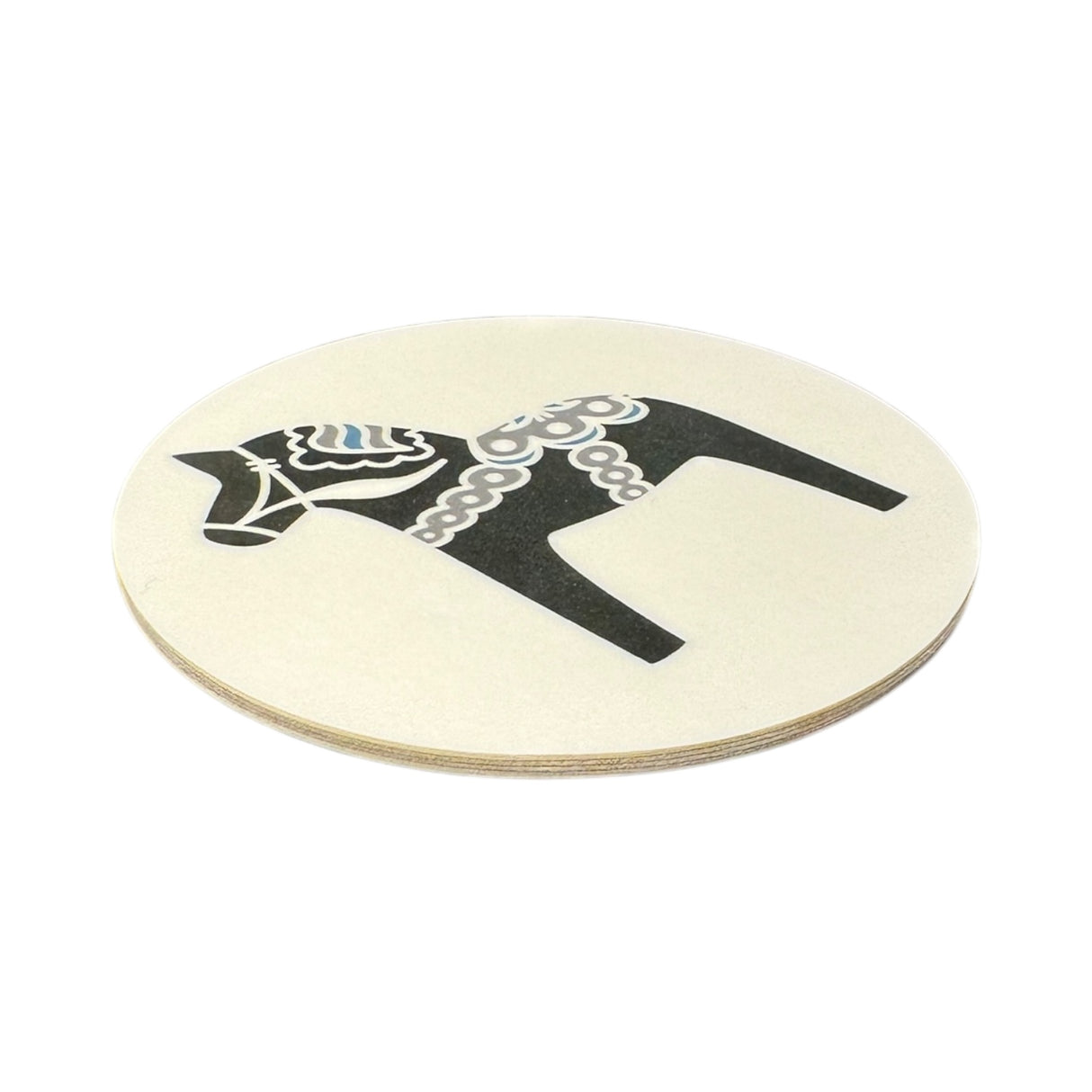 The Round 3.5 Dala Horse Coaster, available in Black, Blue, Red, or Grey, features a stylized horse with decorative patterns and brings Nordic charm to your collection. Made in Sweden.