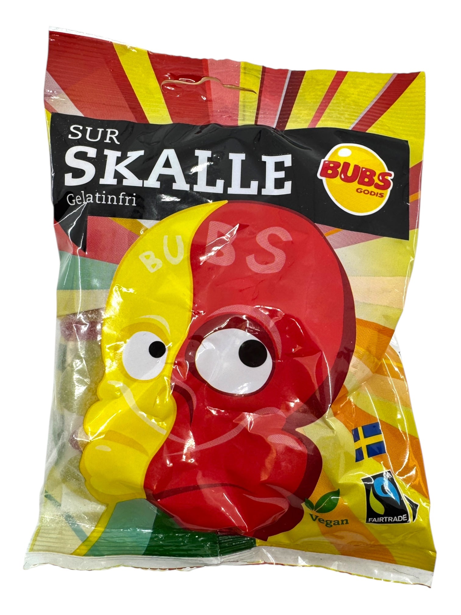A 90g bag of Bubs Skalle Sour Citrus Skulls vegan candy, with red and yellow skulls on the package, made with Fairtrade-certified sugar and showcasing Swedish symbols.