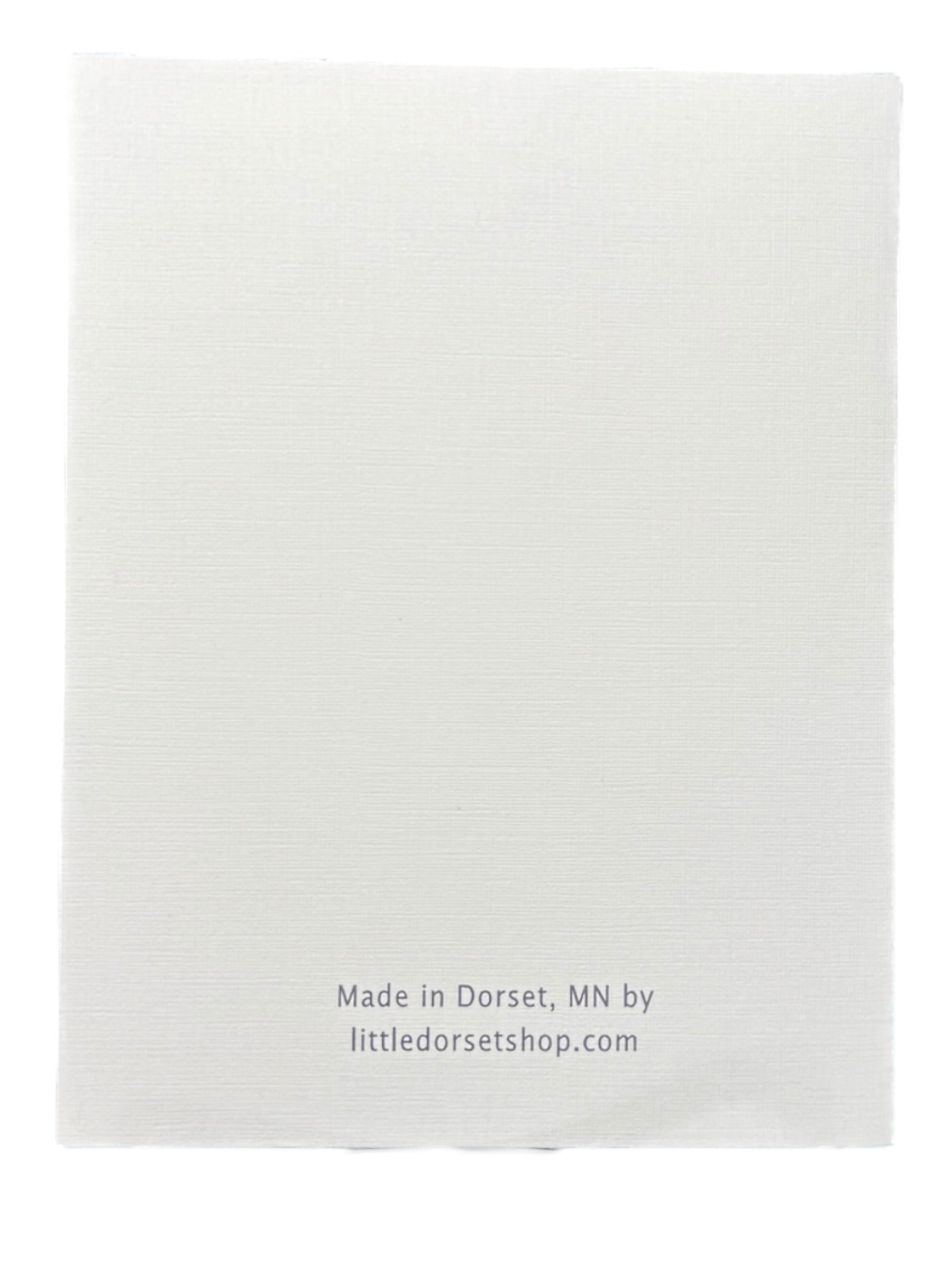 A plain white rectangular card, Card: Hope Your Birthday is Legendary with Bigfoot & Paul Bunyan Birthday Card, with Made in Dorset, MN by littledorsetshop.com in small gray letters at the bottom—perfect for a legendary birthday greeting.