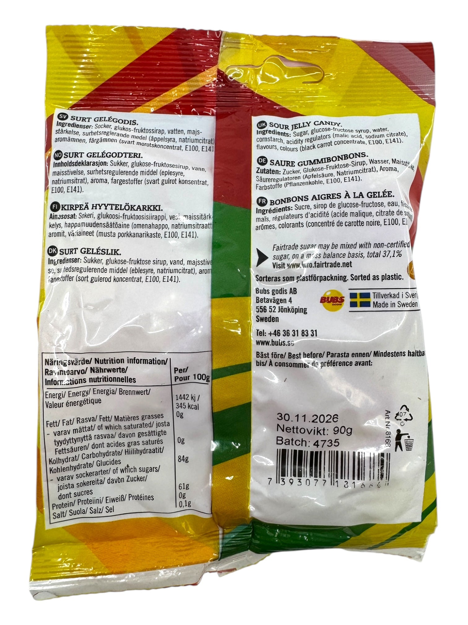 Back view of a Bubs Skalle - Sour Citrus Skulls (90g) package showing Fairtrade sugar, product details, ingredients, nutrition facts, and barcode in several languages.