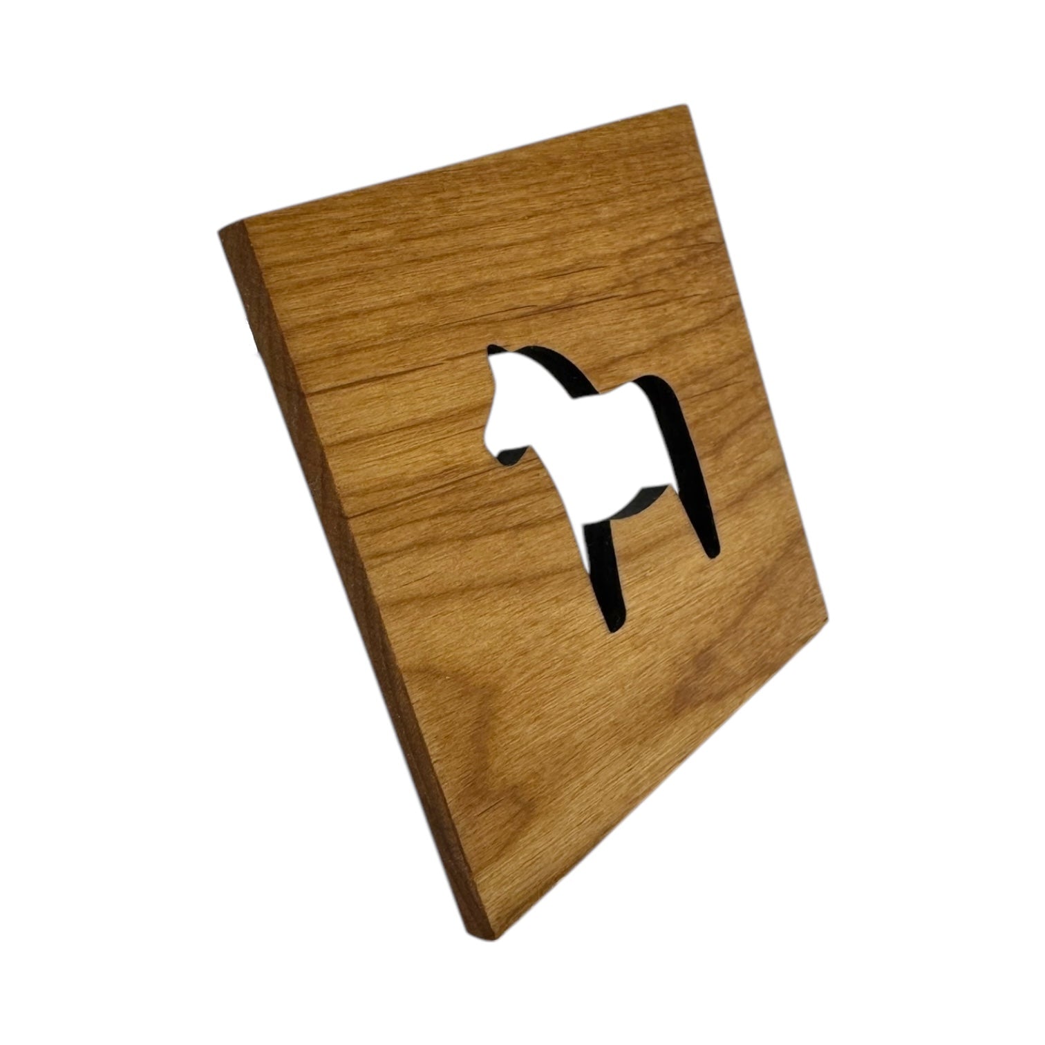 The 4x4 Square Alder Coaster features a Swedish Dala Horse cutout, showcasing Scandinavian design in alder wood, viewed at an angle against a white background.