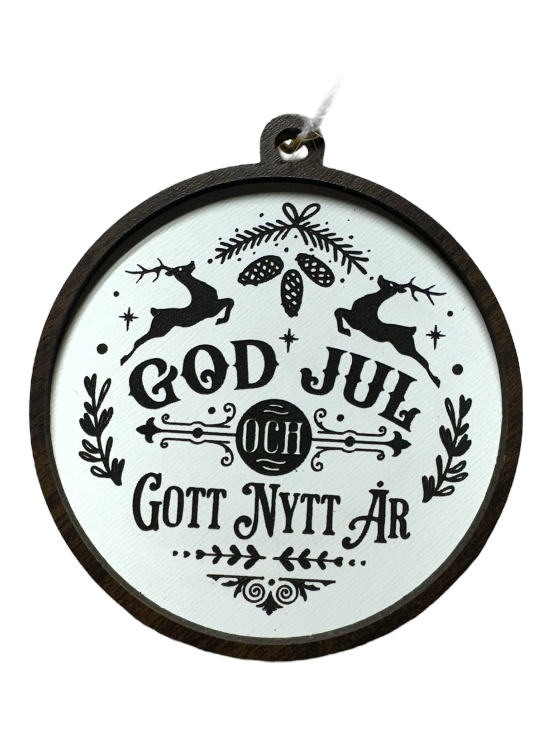 God Jul White & Gott Nytt År ornament features black holiday text with reindeer, pinecones, and foliage on white; hangs by a string—a festive way to celebrate Swedish Christmas traditions.