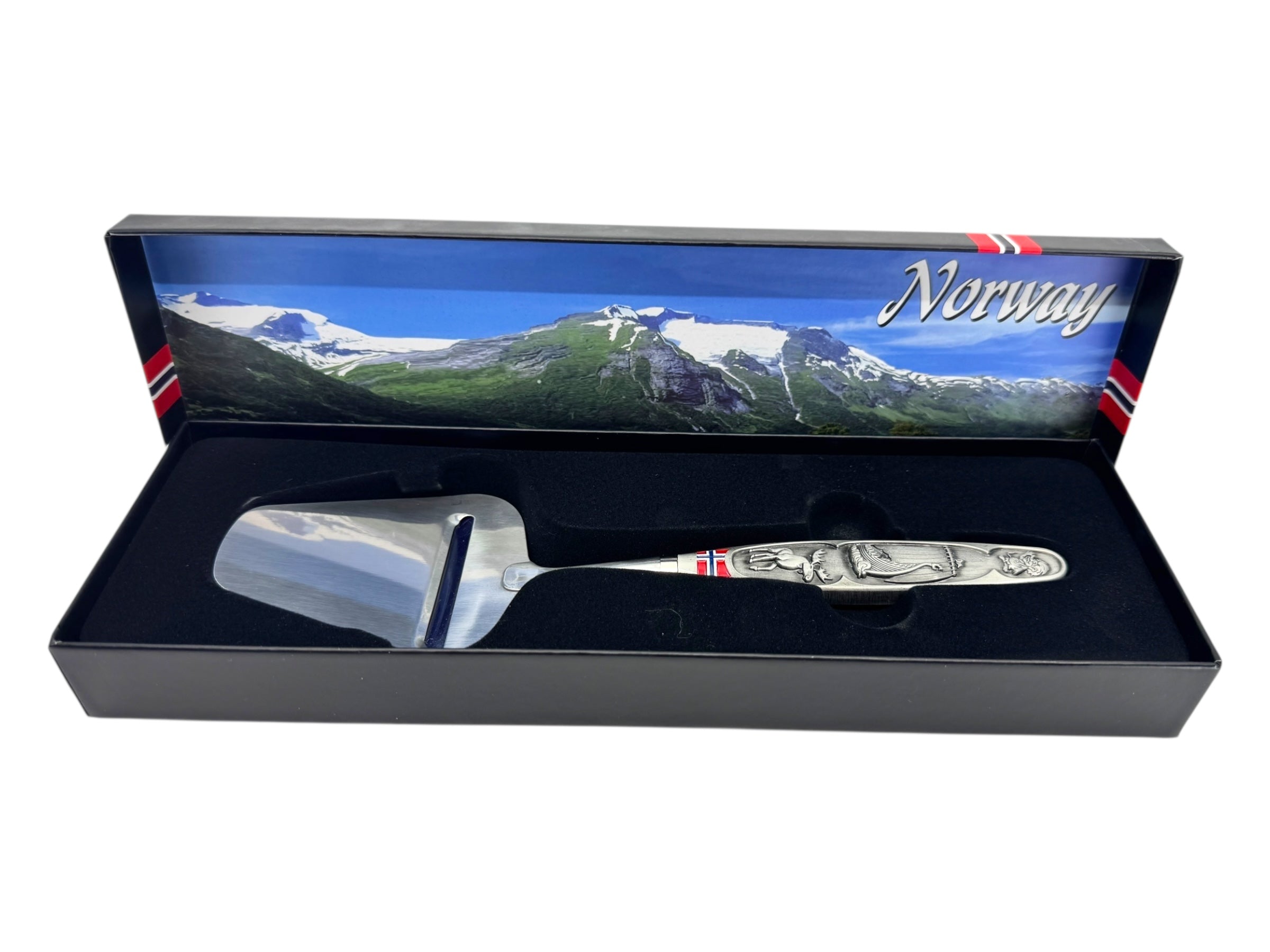 A smooth Norwegian cheese slicer with a pewter handle featuring Viking ship and moose images comes boxed, highlighting Nordic heritage.