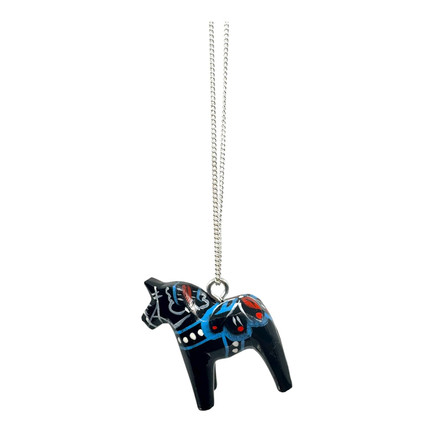 The Necklace: Black Dala Horse Necklace – Handcrafted Pendant features a silver chain and a hand-painted black wooden horse with blue, red, and white Scandinavian folk art patterns, celebrating Swedish craftsmanship.