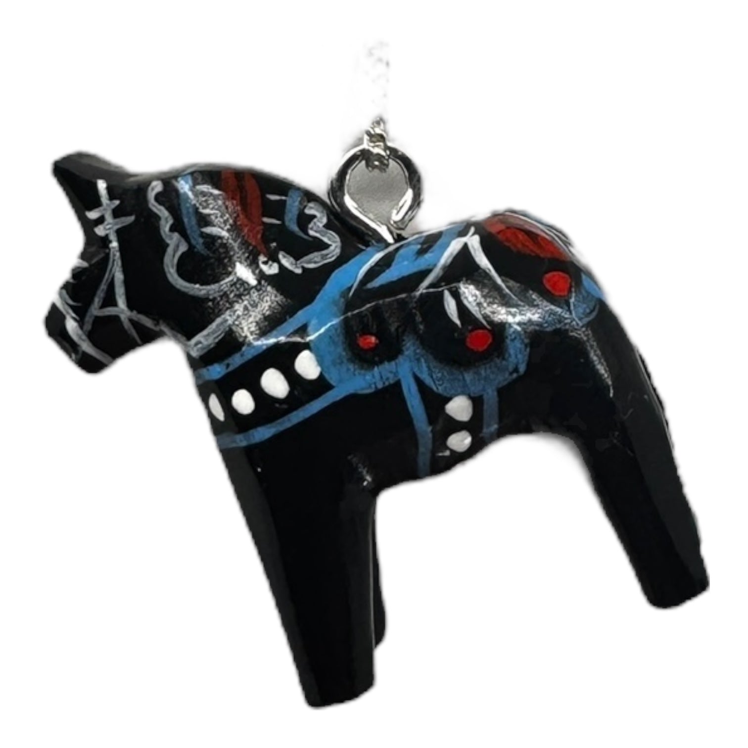The Black Dala Horse Necklace is a handcrafted pendant inspired by Scandinavian folk art, featuring painted red, blue, and white patterns—a tribute to traditional Swedish craftsmanship.