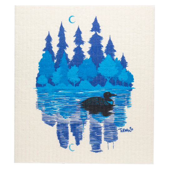 The serene artwork of a lake with a black bird swimming amidst blue trees and crescent moons mirrors the tranquility and sustainability of the Minnesota Loon by Adam Turman Swedish Dish Cloth, which is reusable and compostable in its earth-friendly design.