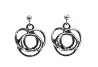The Flor Alida Floral Earrings are sterling silver dangle earrings featuring abstract, interlocking floral designs inspired by Norwegian jewelry, displayed on a white background.