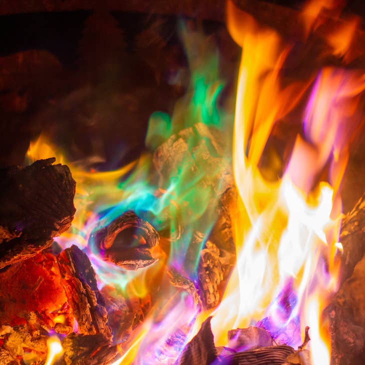 Fire Color Cones: Northern Lights for Fireside Nights fill your campfire with blue, green, yellow, and orange flames that dance over glowing logs and ashes, bringing the magic of northern lights to your outdoor fires.