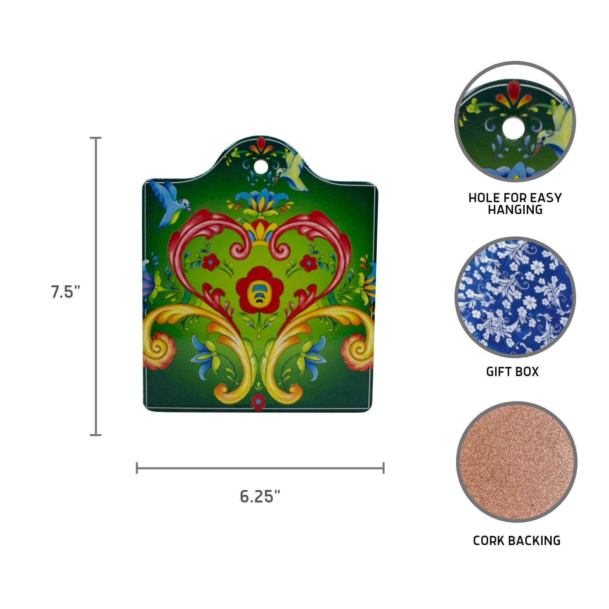 The Rosemaling Green Ceramic Cheeseboard Kitchen Trivet features a floral design, measures 7.5 x 6.25 in, includes a hole for hanging, cork backing, and is gift boxed—ideal for Scandinavian kitchen decor or a charming Norwegian gift.