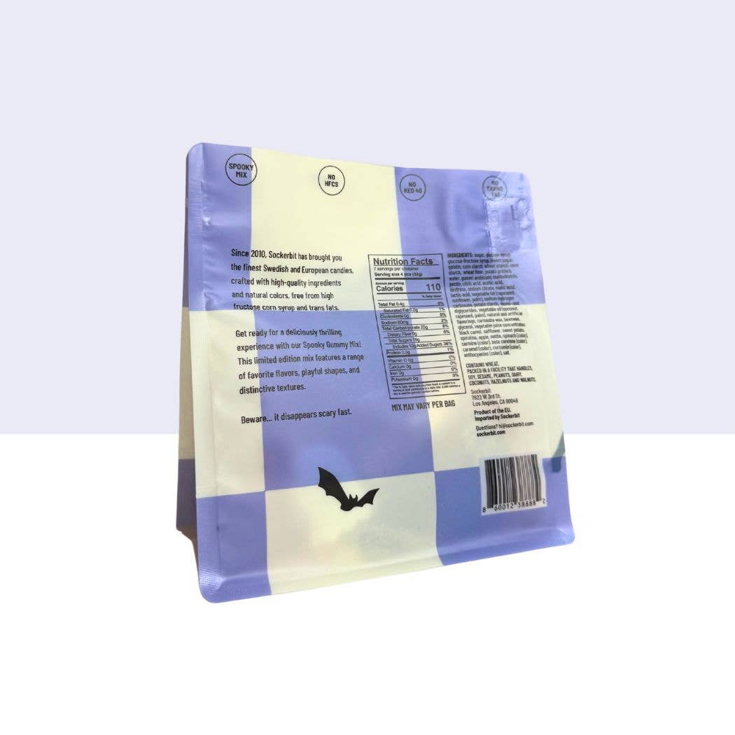 A blue and white 8 oz Spooky Swedish Gummy Mix bag stands upright, showing text, a barcode, nutrition facts, and a bat graphic—perfect for Halloween candy lovers or anyone seeking unique treats.