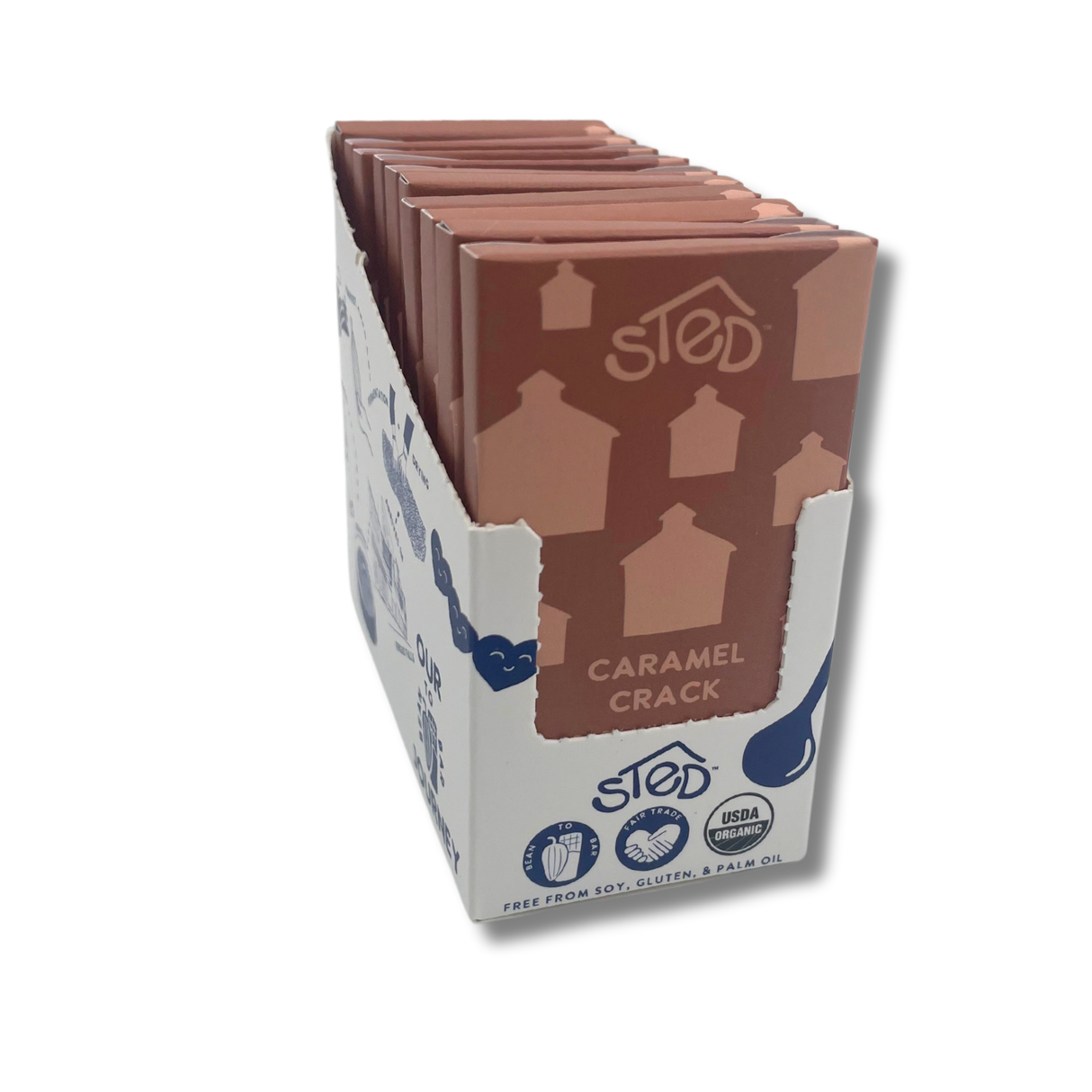 Box of caramel chocolate bars in a white display case, labeled soy-, gluten-, and palm-oil-free, with a visible USDA Organic logo.