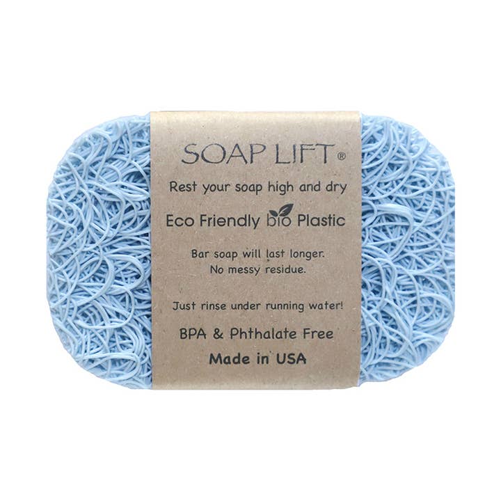A light blue textured Soap Lift: The Original Soap Lift Soap Saver with a brown label stating “Eco Friendly bio plastic, BPA & Phthalate Free, Made in USA.” Keeps soap bars dry and lasting longer.