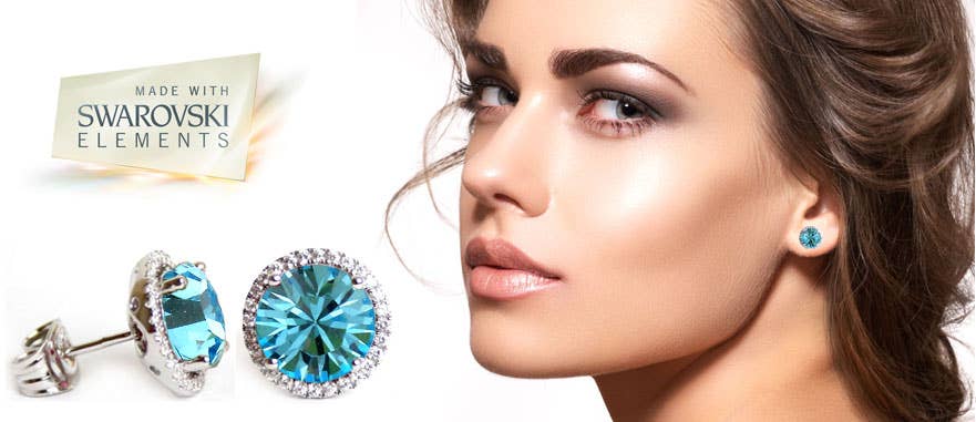 A woman wearing emerald green Swarovski crystal handmade silver solitaire stud earrings, shown in a close-up beside a Made with Swarovski Elements label.