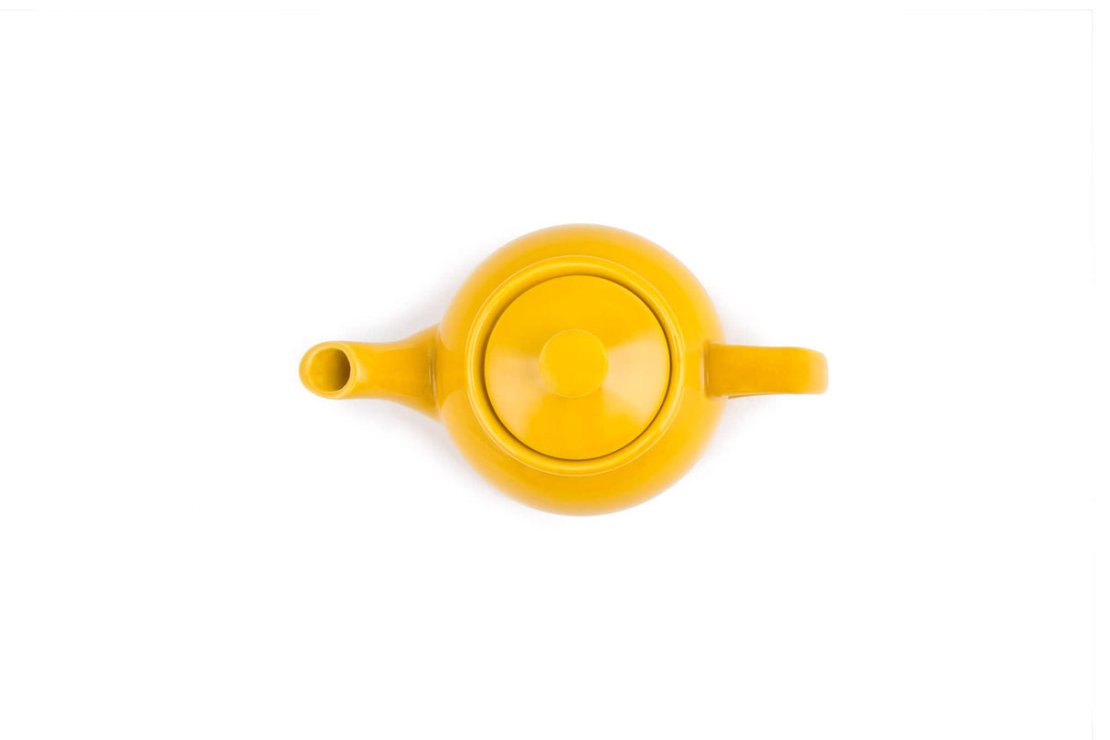 The Tea Pot: Yellow Earthenware Teapot 37-Ounce features a stay-cool handle and is shown from above on a white background.