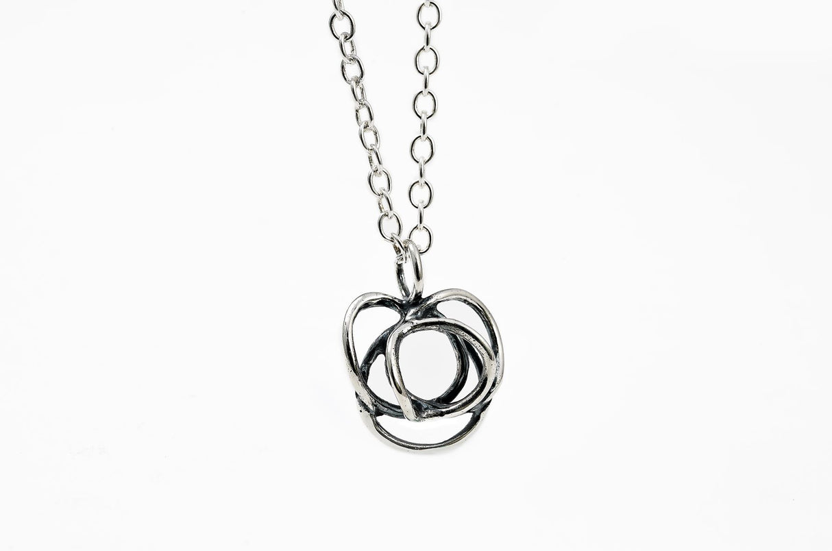 The Flor Alida Floral Necklace in sterling silver features a 5/8" floral pendant on an 18" chain, shown against a plain white background.