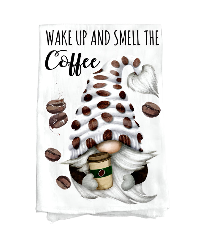 The Tea Towel: Gnome Wake Up and Smell the Coffee Flour Sack Tea Towel features a gnome with a coffee cup, coffee bean accents, and the phrase Wake up and smell the coffee—a soft, charming kitchen gift.
