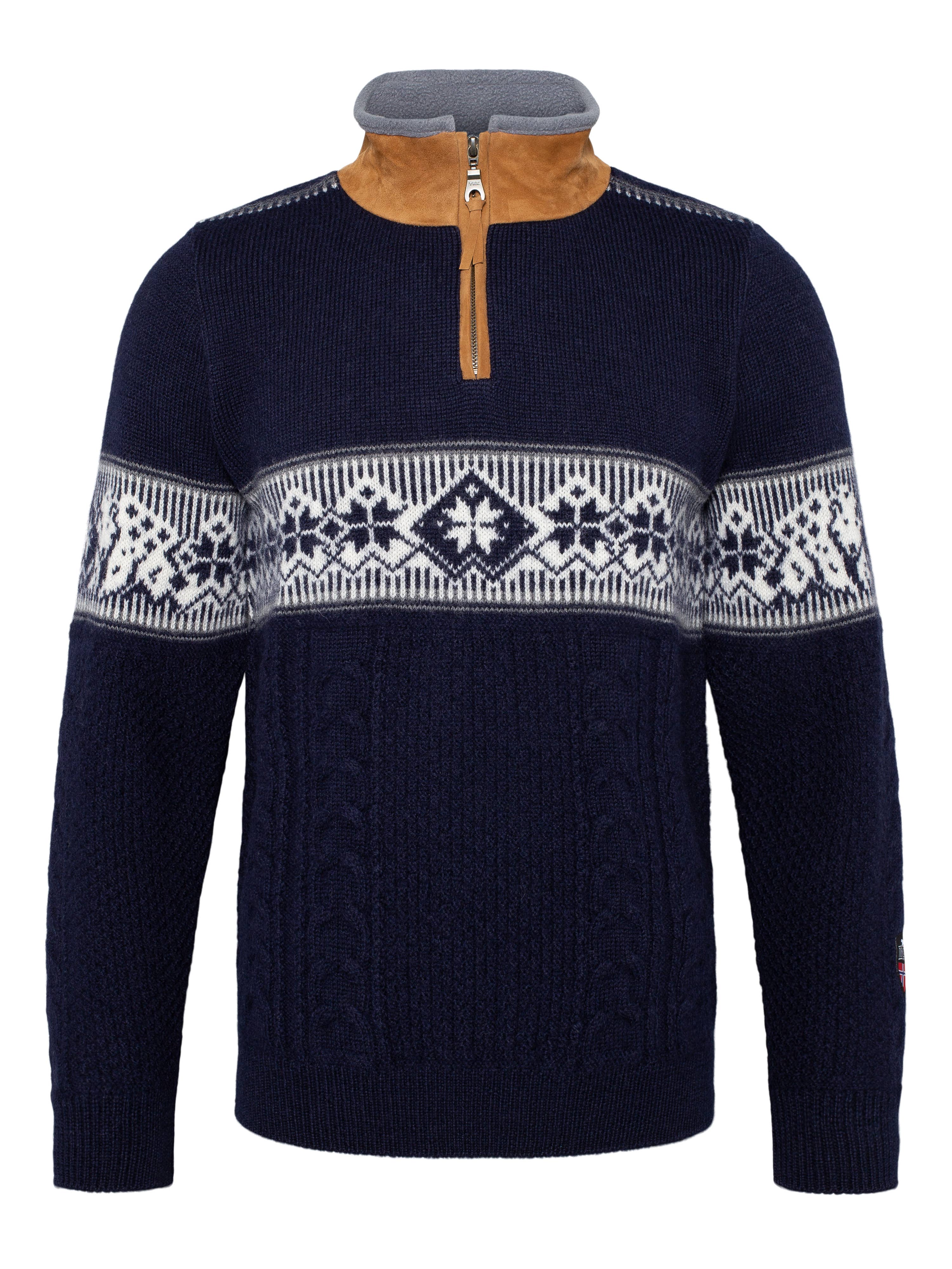The Spitzbergen Polar Sweater - Navy features a white and gray Nordic pattern across the chest, a tan suede-like collar detail, and a short front zipper.