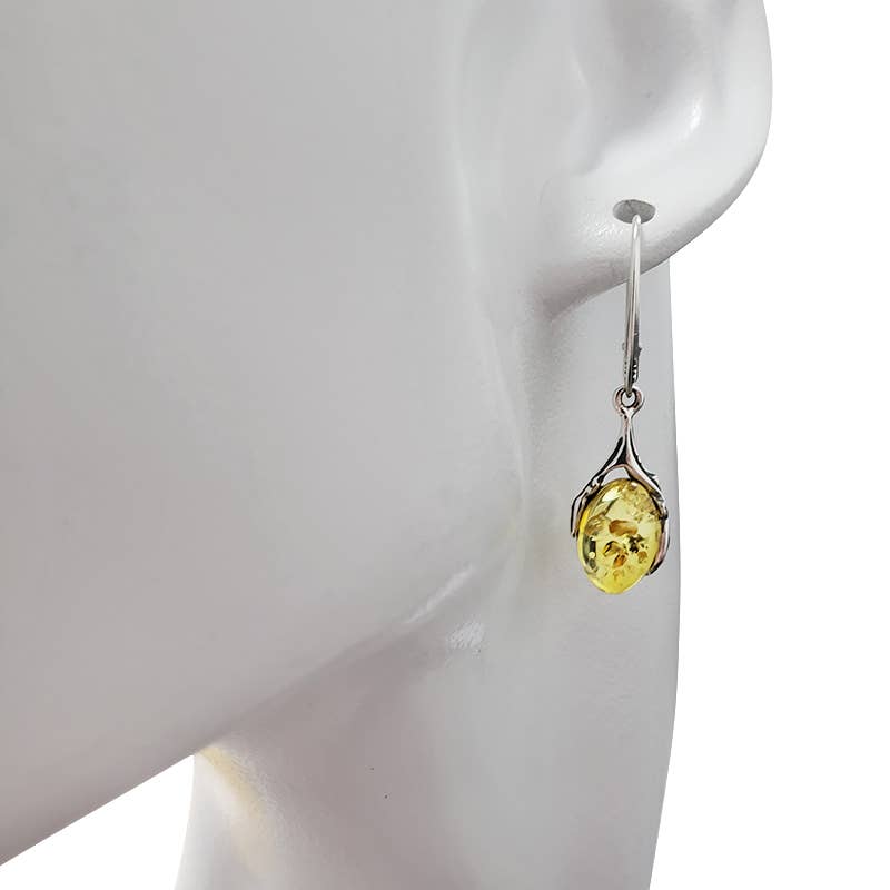 Close-up of a mannequin head wearing oval-shaped Citrine Amber Sterling Silver Earrings on hooks.