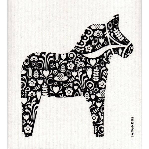 The dish cloth features a Scandinavian-inspired Dala Horse design, filled with an intricate black and white floral and heart pattern set against a textured backdrop.