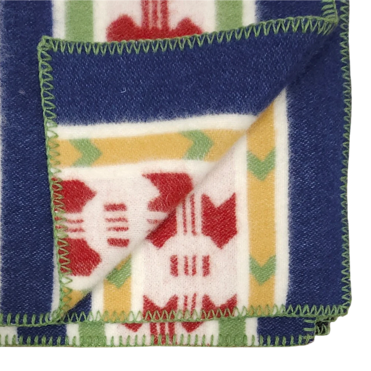 Partially folded blue, cream, and red wool blanket with green-edged stitching, displaying front and back of its Swedish Rättvik pattern.