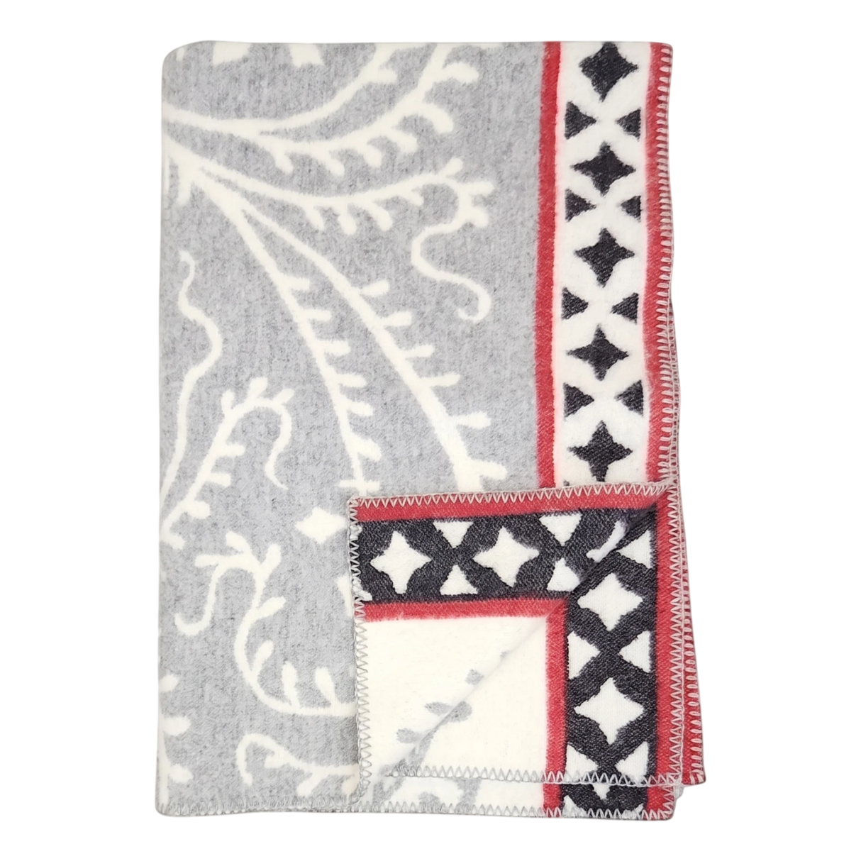 Folded gray fleece blanket with white leaf patterns and a red border featuring black diamond shapes, displayed on a plain white background.