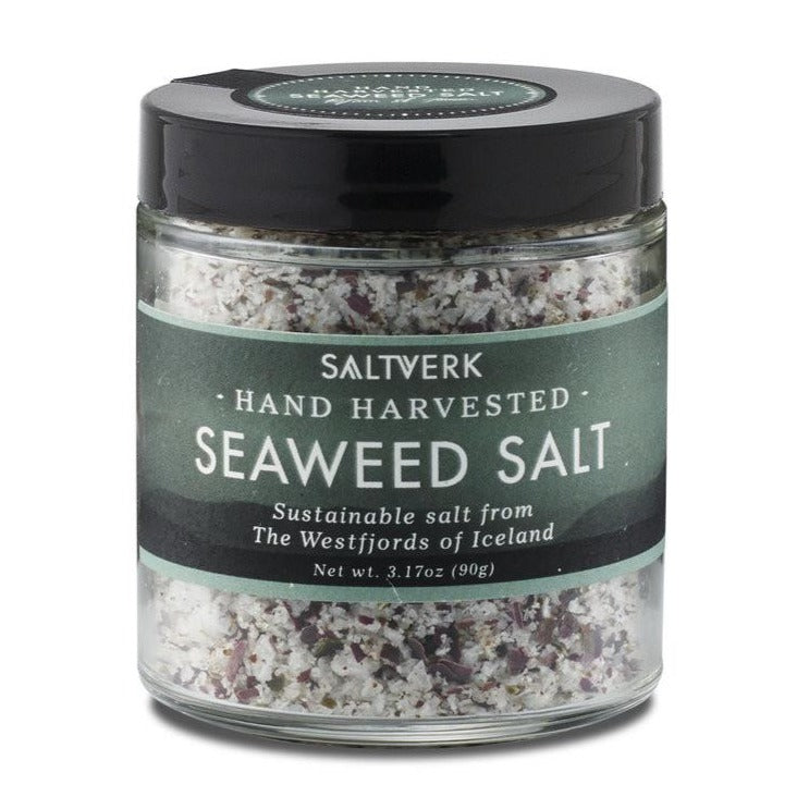 A 90g glass jar of Saltverk Seaweed Salt, hand harvested and sustainable from Icelands Westfjords, with visible salt and seaweed flakes.