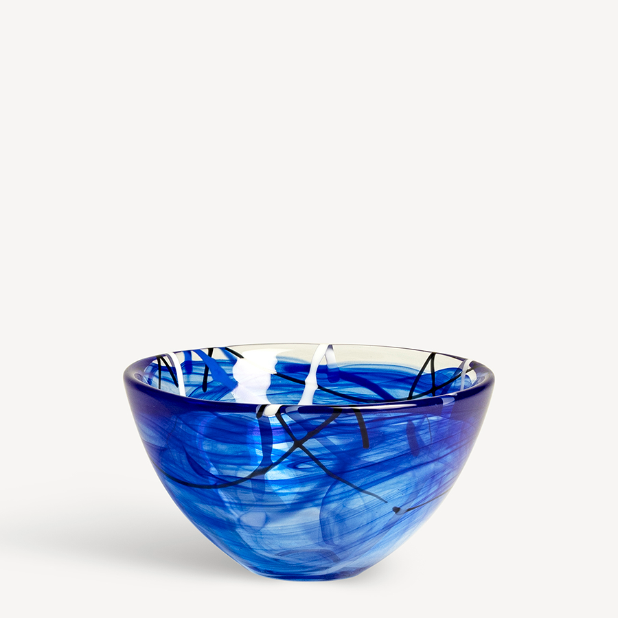 The KostaBoda Contrast Blue Bowl Small by Anna Ehrner, 6.25 (160mm) in diameter, features striking black and white swirls on blue glass, showcased against a plain white background.
