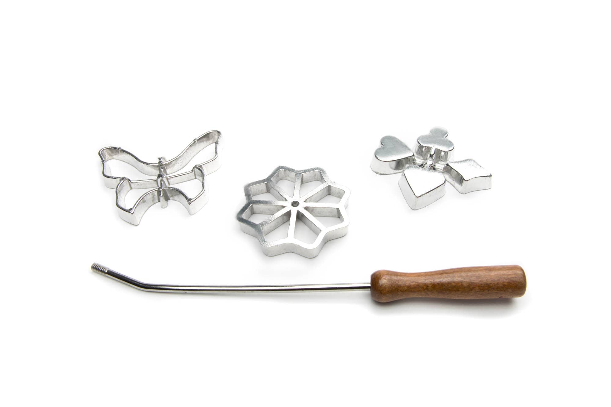 The Cookie Cutter: Rosette Set, Cast-Aluminum, 4-Piece Set includes three metal rosette irons—butterfly, flower, and heart shapes—and a wooden-handled wand, ideal for baking Scandinavian rosette cookies. All shown on a white background.
