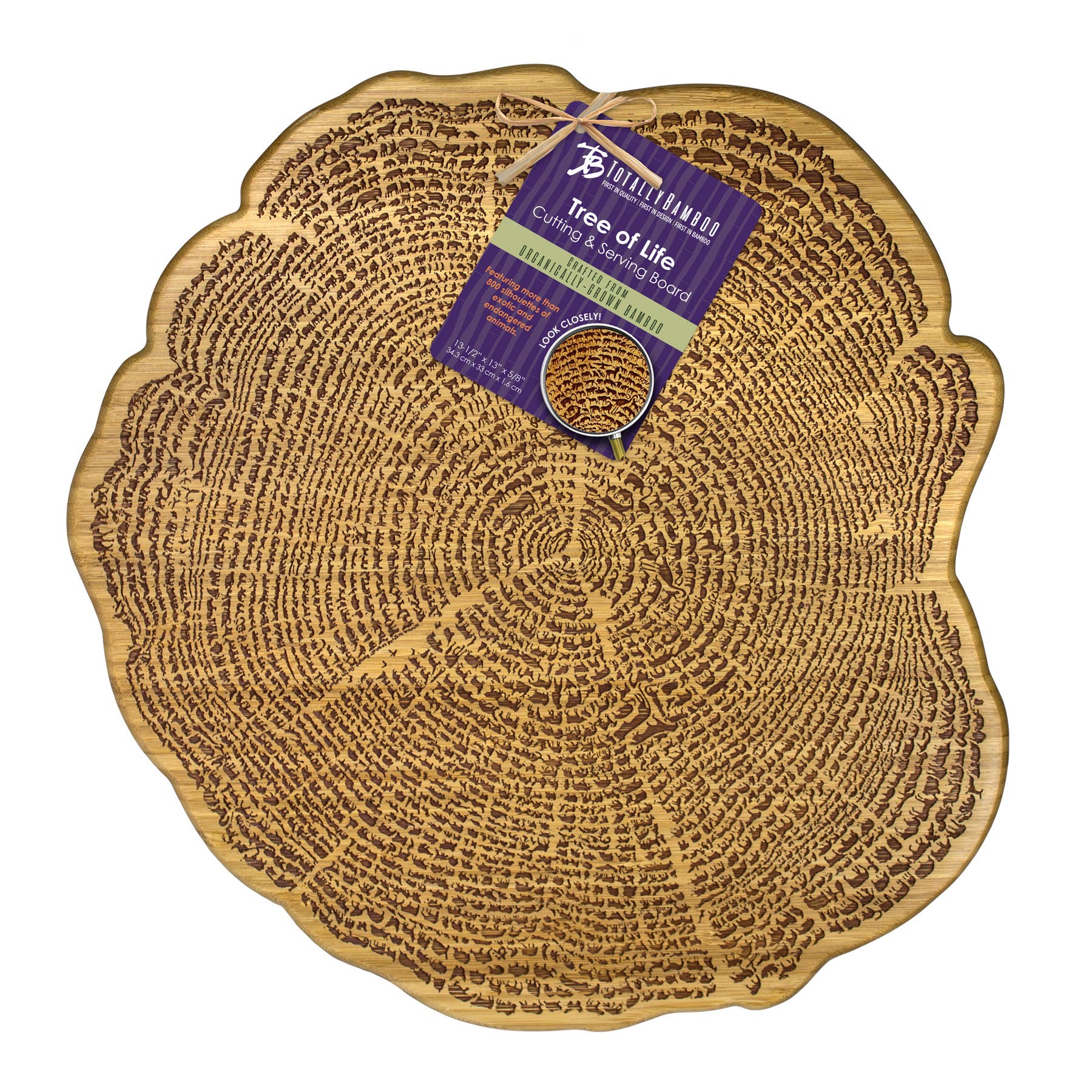 The Tree Of Life Bamboo Serving Board (13) features over 800 engraved silhouettes of exotic and endangered animal species in concentric rings, with an attached product label at the top.