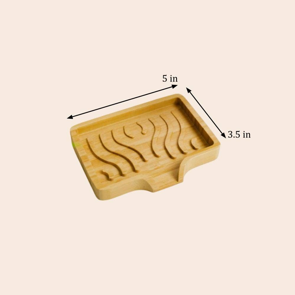 Rectangular bamboo tray with curved grooves on top, measuring 5 inches wide by 3.5 inches deep, shown from above against a plain background.