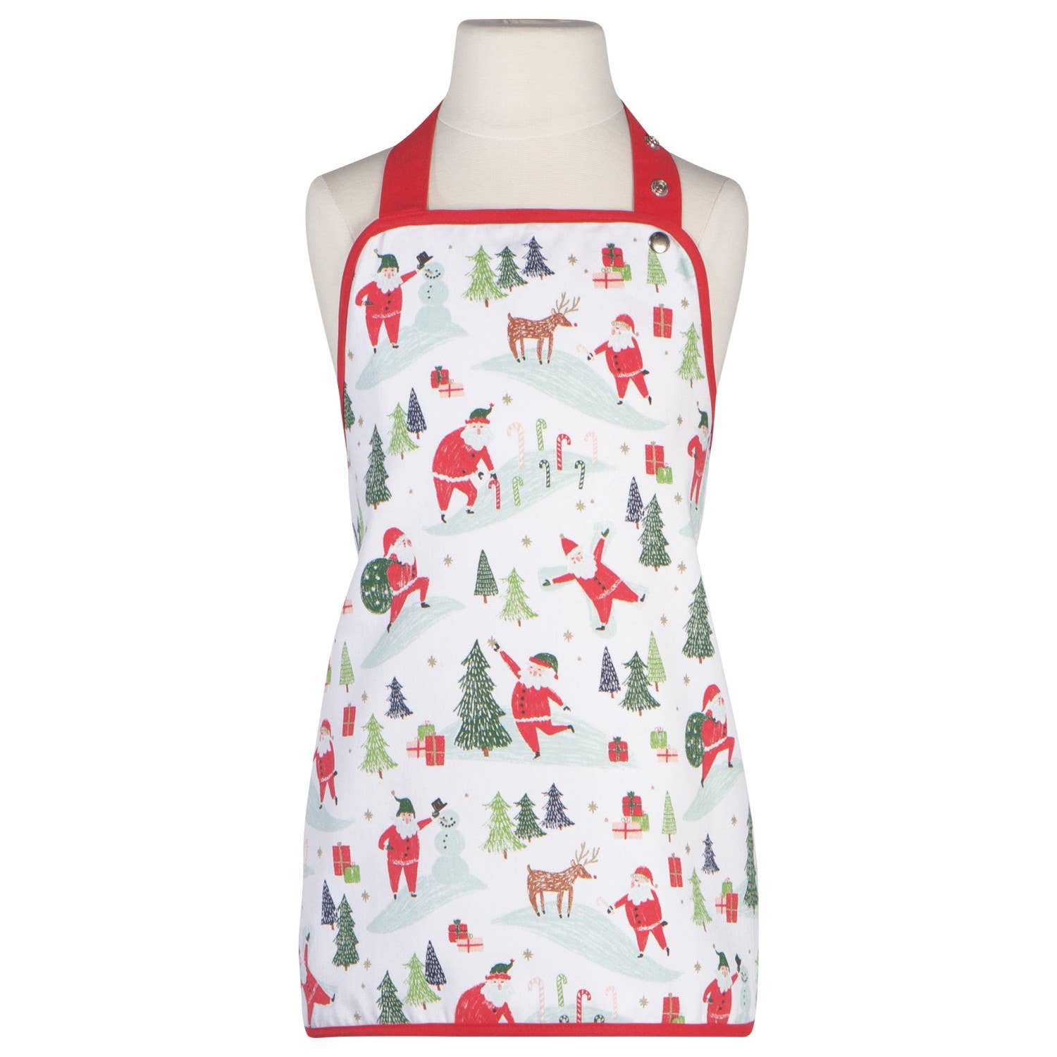 A mannequin displays the "Kids Apron - Must Be Santa," a festive white baking apron with red straps, decorated with Christmas-themed illustrations of Santa Claus, reindeer, gifts, trees, and candy canes.