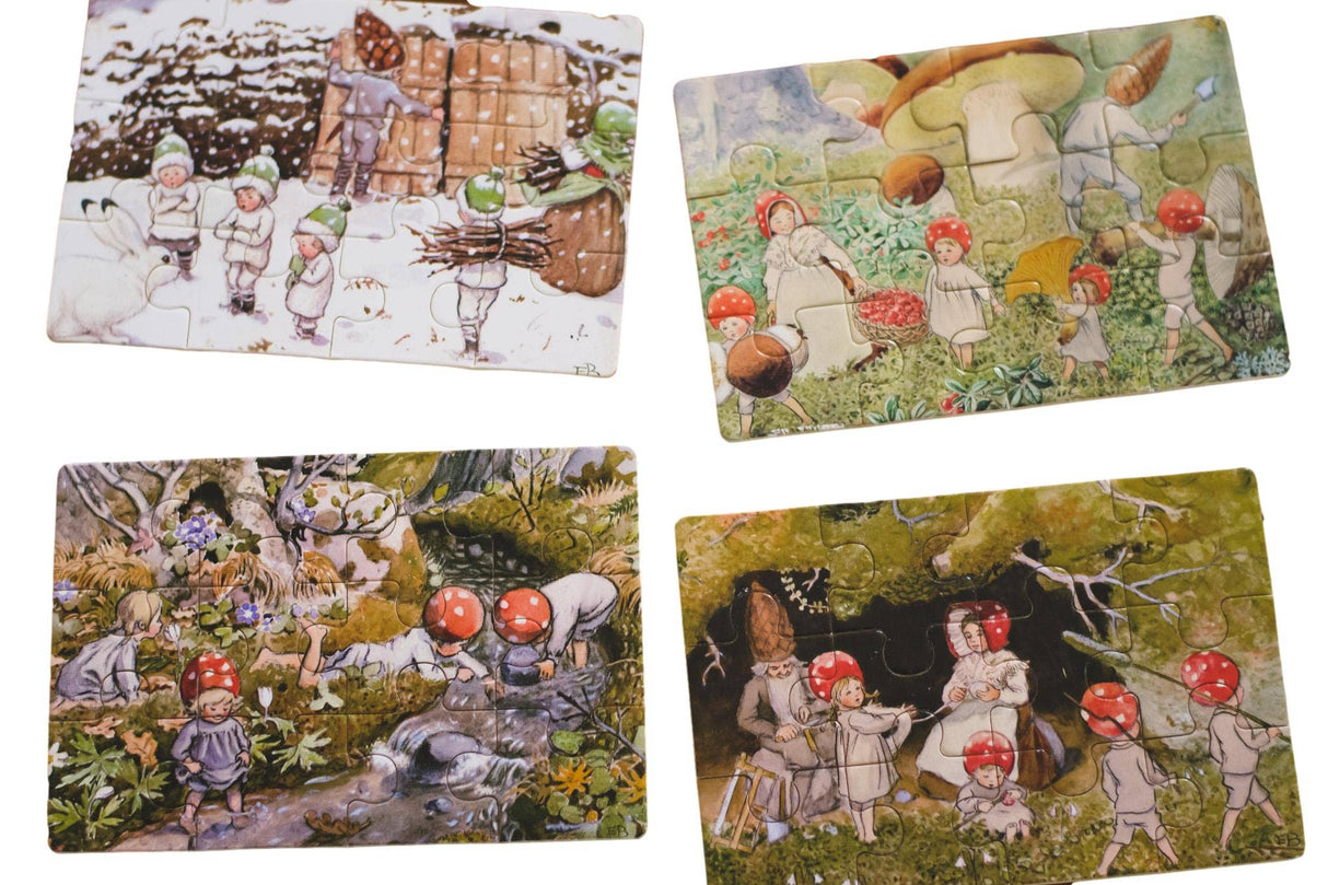 Four illustrated postcards, inspired by the "Children of the Forest" Elsa Beskow 4 tray wooden box puzzle, feature red-capped children exploring forest and snowy landscapes.