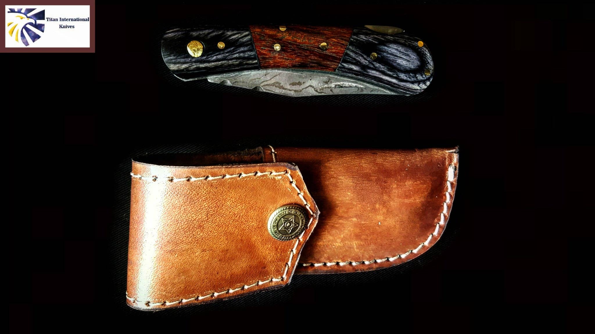 The Damascus Steel Pocket knife with a walnut wood handle and metal accents is displayed above a brown leather sheath on a black background.