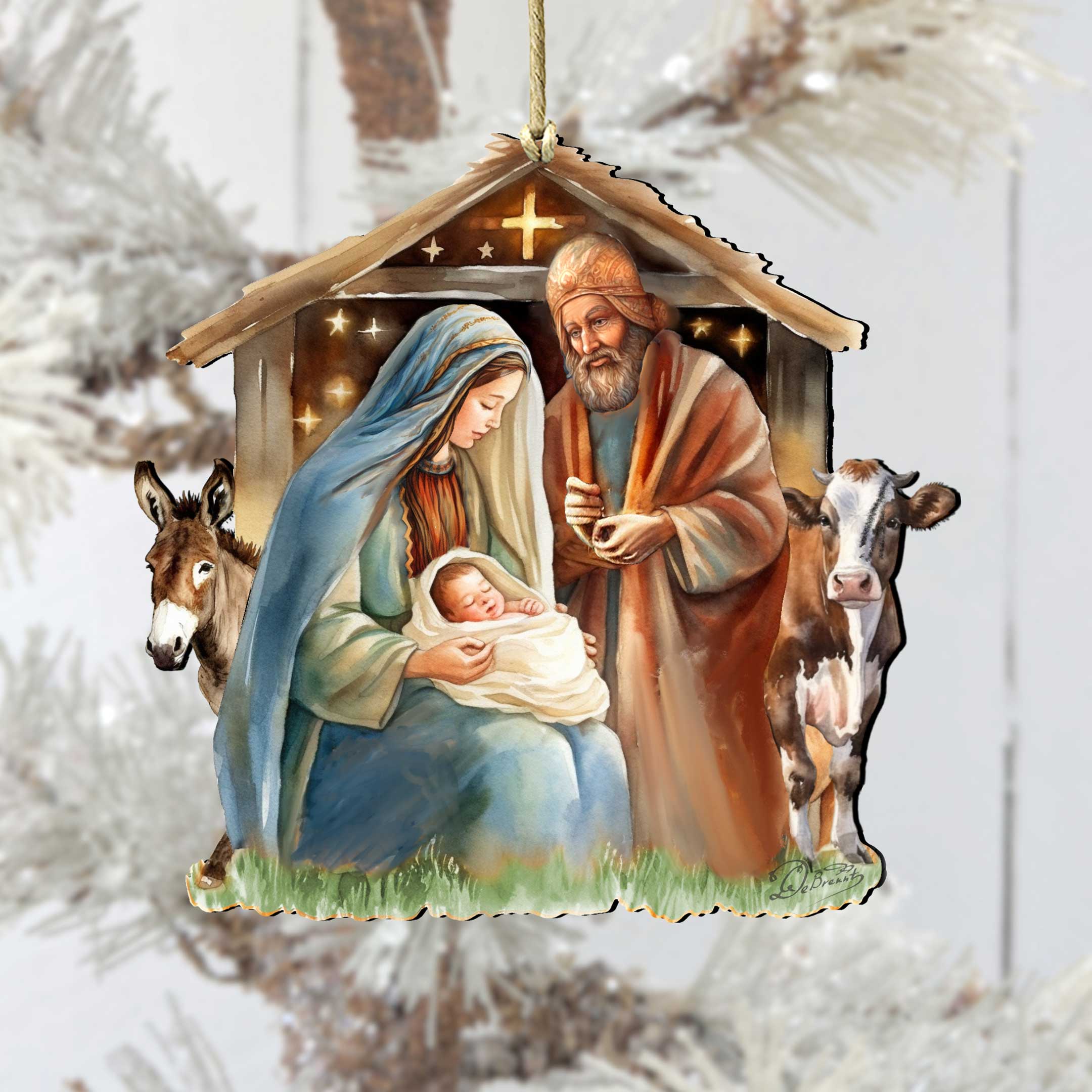 The "Born Under Bright Star Nativity Wooden Ornament" by G. DeBrekht (approx. 5 x 4.75 in) features Mary, Joseph, and baby Jesus in a stable with a donkey and cow—a charming addition to your nativity ornament collection.