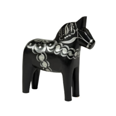 The Dala Horse: Celebrate Black & Silver, a hand-crafted black wooden figure adorned with intricate silver patterns, stands gracefully against a pristine white background, embodying Swedens traditional artistry.