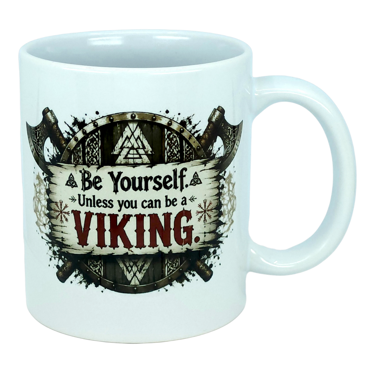 Start your day like a true legend with the Mug: Be Yourself Unless You Can Be A Viking Ceramic Mug (11 oz Capacity) from Nordic Wholesale. This white ceramic mug features striking Viking-themed artwork depicting two axes and a wooden shield, along with the empowering text: "Be Yourself. Unless you can be a VIKING." Ideal for fans of Norse mythology mugs and anyone who admires legendary warriors as part of their morning coffee ritual.
