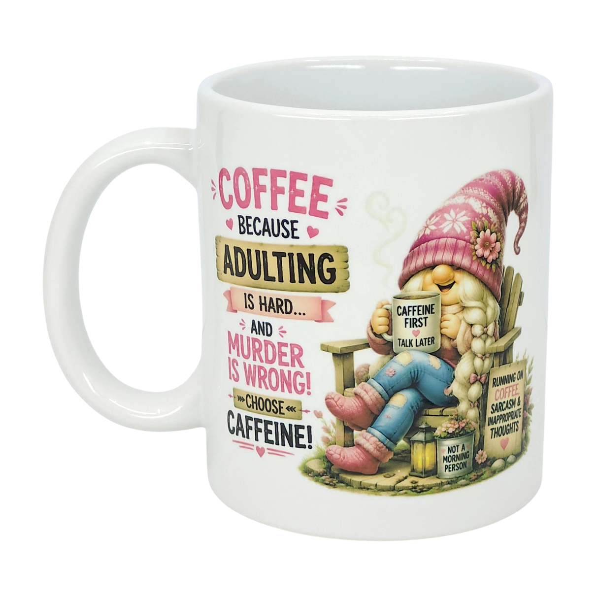 The Nordic Wholesale Mug: Choose Caffeine Tomte Ceramic Mug (11 oz) features a cartoon gnome in a pink hat and funny text: "Coffee because adulting is hard... and murder is wrong!"—a witty choice for caffeine lovers.