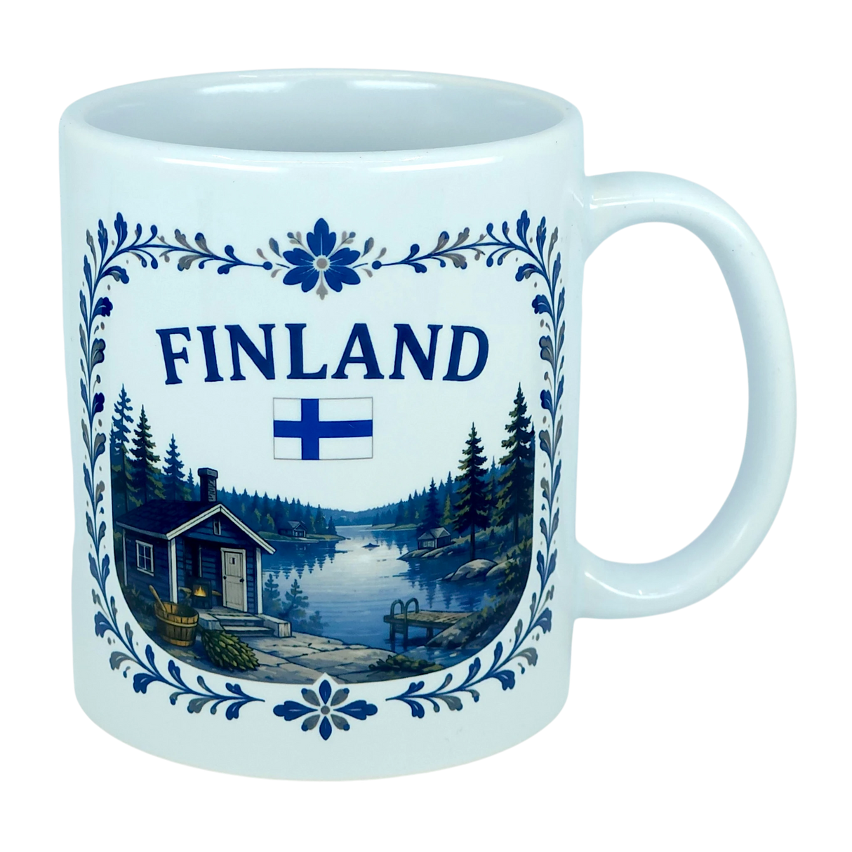 The Nordic Wholesale Mug: Finland Lakeside Cabin Ceramic Mug (11 oz Capacity) is a white Finnish ceramic mug decorated with the Finnish flag and an illustration of a Nordic lakeside cabin nestled among trees, all bordered by an elegant blue floral design—making it an ideal gift to celebrate Finnish heritage.