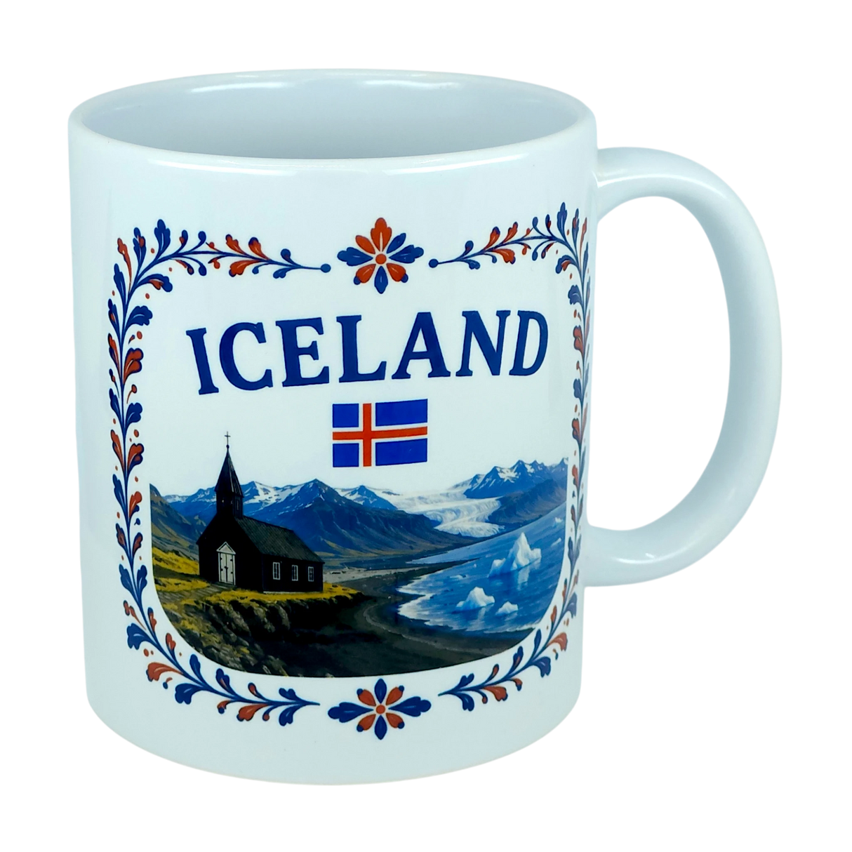 Celebrate Icelandic heritage with the Nordic Wholesale Mug: Iceland Church Mountain Ceramic Mug (11 oz Capacity). This white mug features the “ICELAND” text, the Icelandic flag, and a scenic illustration of mountains, a black church, and water framed by a floral border—a perfect gift that beautifully captures the Nordic landscape.