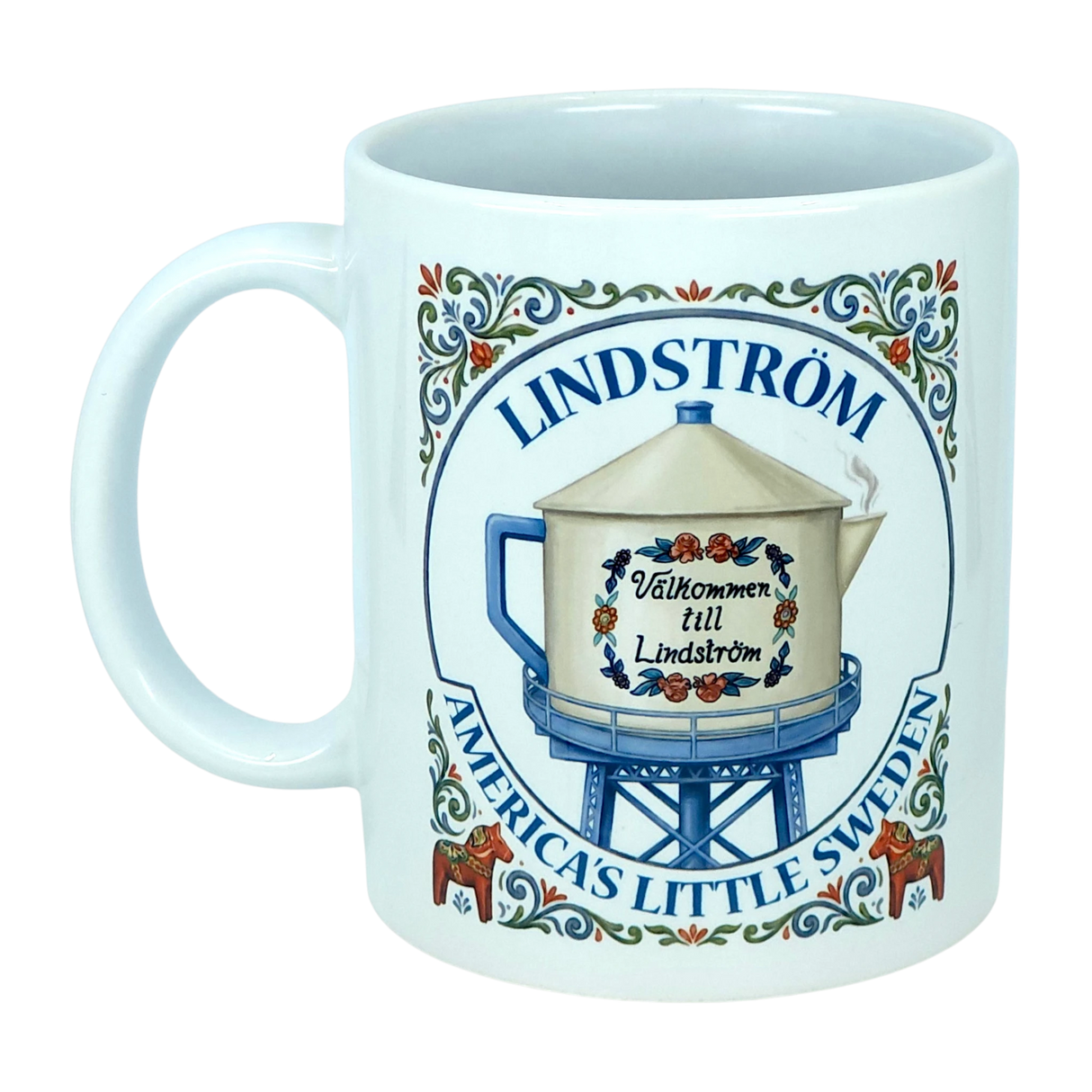 Show your Lindström pride with the Mug: Lindstrom America's Little Sweden Ceramic Coffee Mug (11 oz) by Nordic Wholesale. This white ceramic mug features a decorative illustration of a water tower labeled "Lindström," adorned with Swedish-style floral accents inspired by Scandinavian folk art, along with the phrases "Välkommen till Lindström" and "America’s Little Sweden." A charming keepsake or gift for anyone celebrating their Lindström roots and Swedish heritage.
