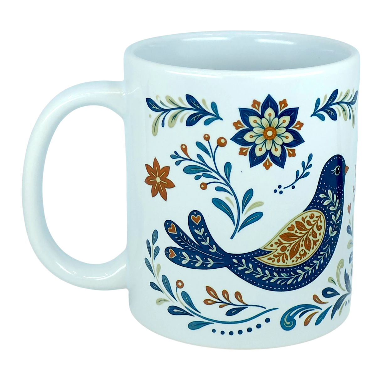 The Nordic Wholesale Mug: Nordic Folk Art Birds Ceramic Mug (11 oz Capacity) features a white ceramic design decorated with a Scandinavian-inspired blue and gold folk-art bird, surrounded by intricate blue, gold, and orange floral and leafy patterns.