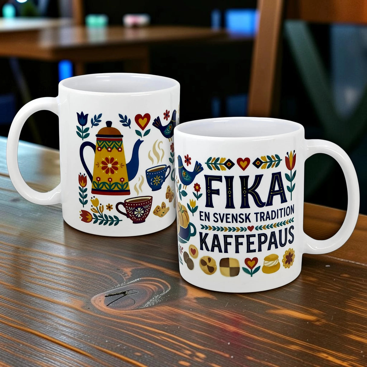 Two white 11 oz ceramic mugs from Swedish Gift Store feature colorful Scandinavian designs. One "Swedish Fika Traditions" mug reads FIKA EN SVENSK TRADITION KAFFEPAUS, surrounded by flowers, pots, and cups—perfect for your next coffee break.