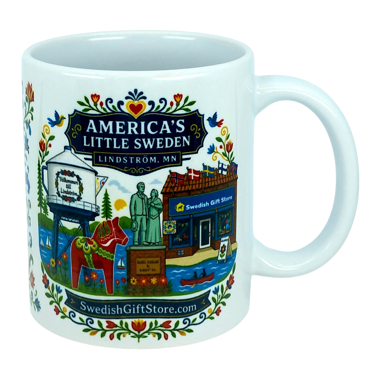 The Nordic Wholesale Mug: Swedish Gift Store America's Little Sweden Ceramic Mug (11 oz) is a white ceramic mug in a charming Nordic style, featuring colorful illustrations of Lindström, Minnesota—including the town’s iconic water tower, Swedish horse, local store, statues, and floral patterns. The mug displays the text "America's Little Sweden, Lindström, MN," making it a perfect Swedish-American gift for celebrating your heritage or love of Scandinavian design.