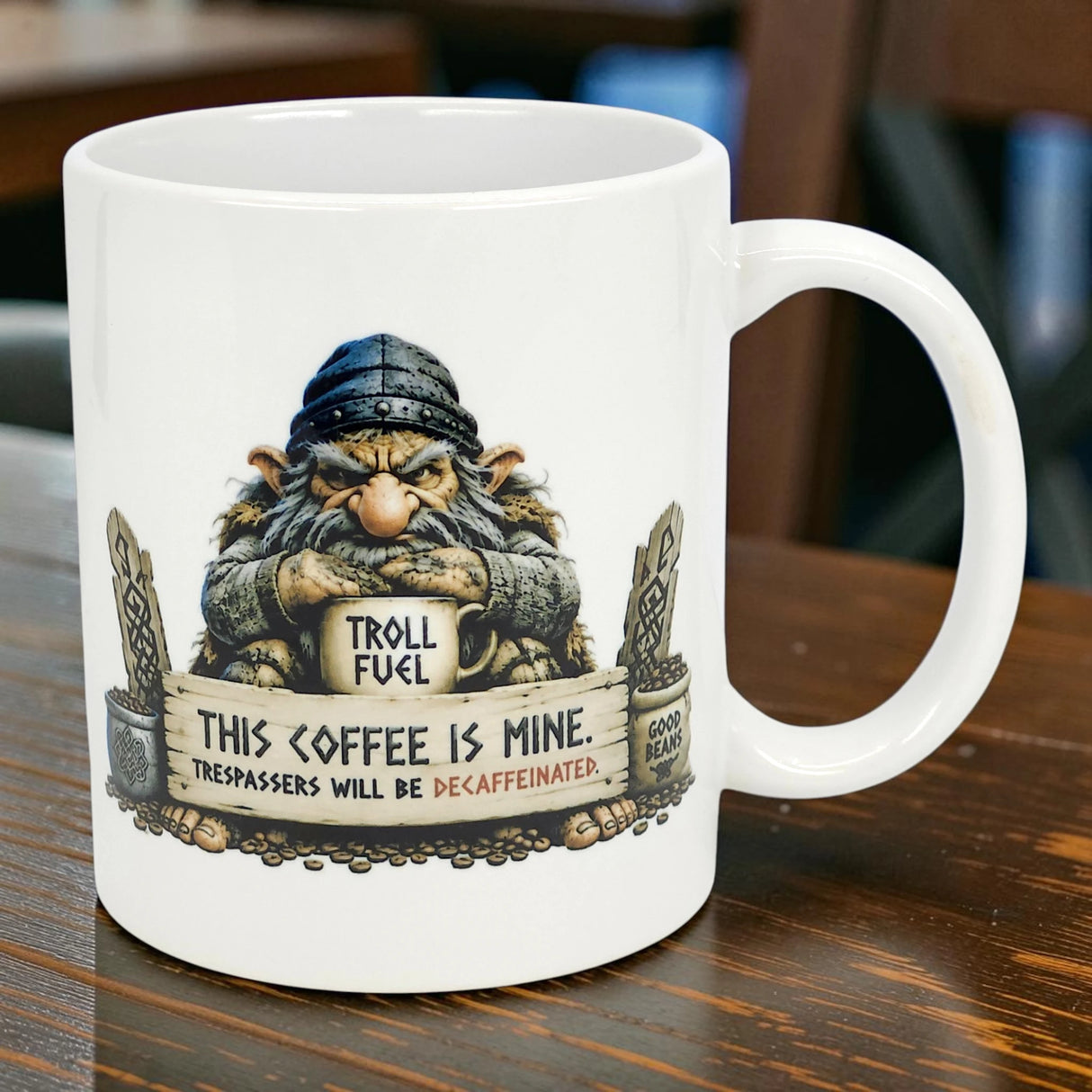 The Nordic Wholesale Mug: Troll Fuel Ceramic Coffee Mug (11 oz Capacity) features a grumpy Scandinavian troll holding a "TROLL FUEL" sign, perfect for adding playful Nordic folklore humor to your coffee routine.