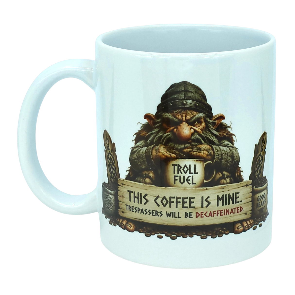 Introducing the Troll Fuel Ceramic Coffee Mug (11 oz Capacity) from Nordic Wholesale. This whimsical ceramic mug showcases a grumpy troll inspired by classic Nordic folklore, grasping a cup labeled "Troll Fuel." Accented with decorative details and coffee beans, the design features bold text: "THIS COFFEE IS MINE. TRESPASSERS WILL BE DECAFFEINATED." Perfect for adding Scandinavian charm to your coffee ritual.