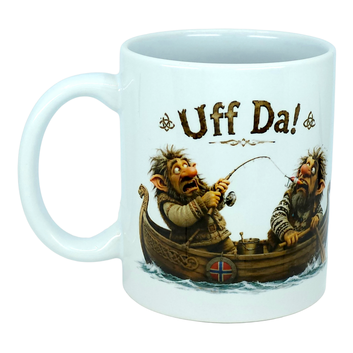 The Mug: Uff Da Fishing Trolls Ceramic Mug (11 oz Capacity) by Nordic Wholesale features two cartoon trolls fishing from a wooden boat with a Norwegian flag. Above them, the large playful text reads “Uff Da!”—making this ceramic mug ideal for anyone who enjoys Scandinavian humor and charming designs.