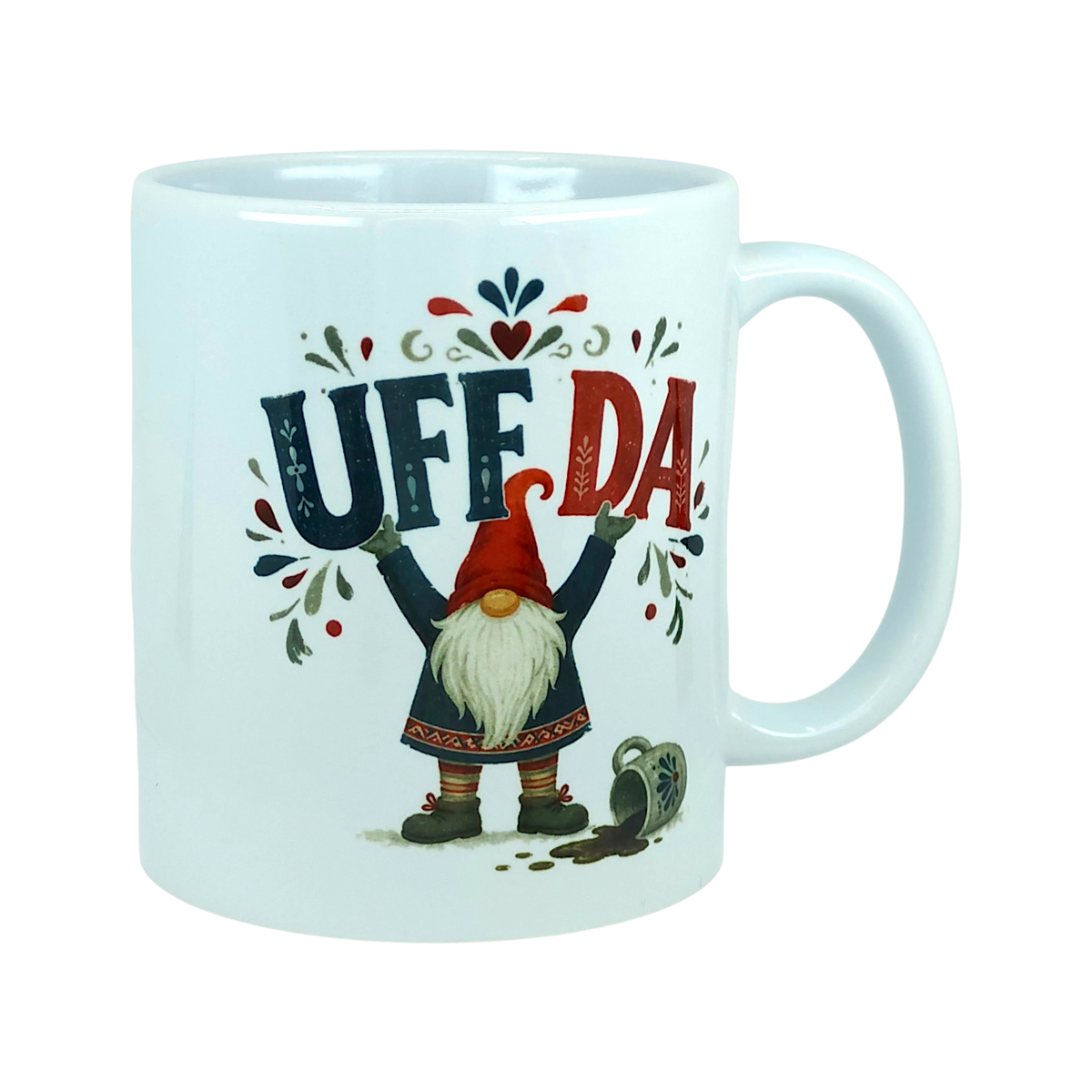 White mug with a tomte gnome holding the text UFF DA, a spilled mug illustration, and Scandinavian floral accents.