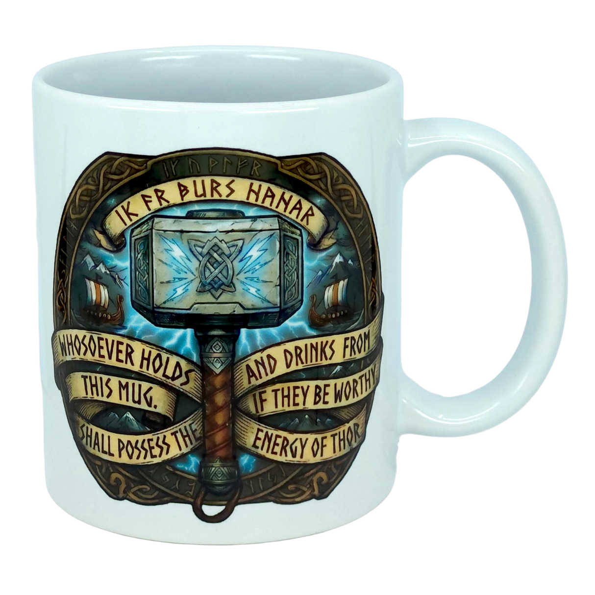 The Mug: Viking Energy of Thor Ceramic Mug (11 oz) by Nordic Wholesale is a white mug showcasing Thor’s hammer with intricate Norse designs and the inscription: “Whosoever holds this mug and drinks from it, if they be worthy, shall possess the energy of Thor.”.