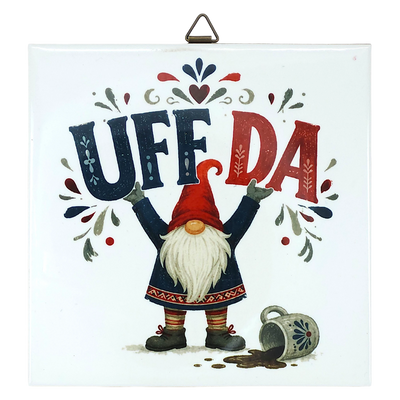 Square Scandinavian wall plaque featuring a ceramic tomte gnome in a red cap, the text UFF DA above a spilled mug, and folk-art patterns.